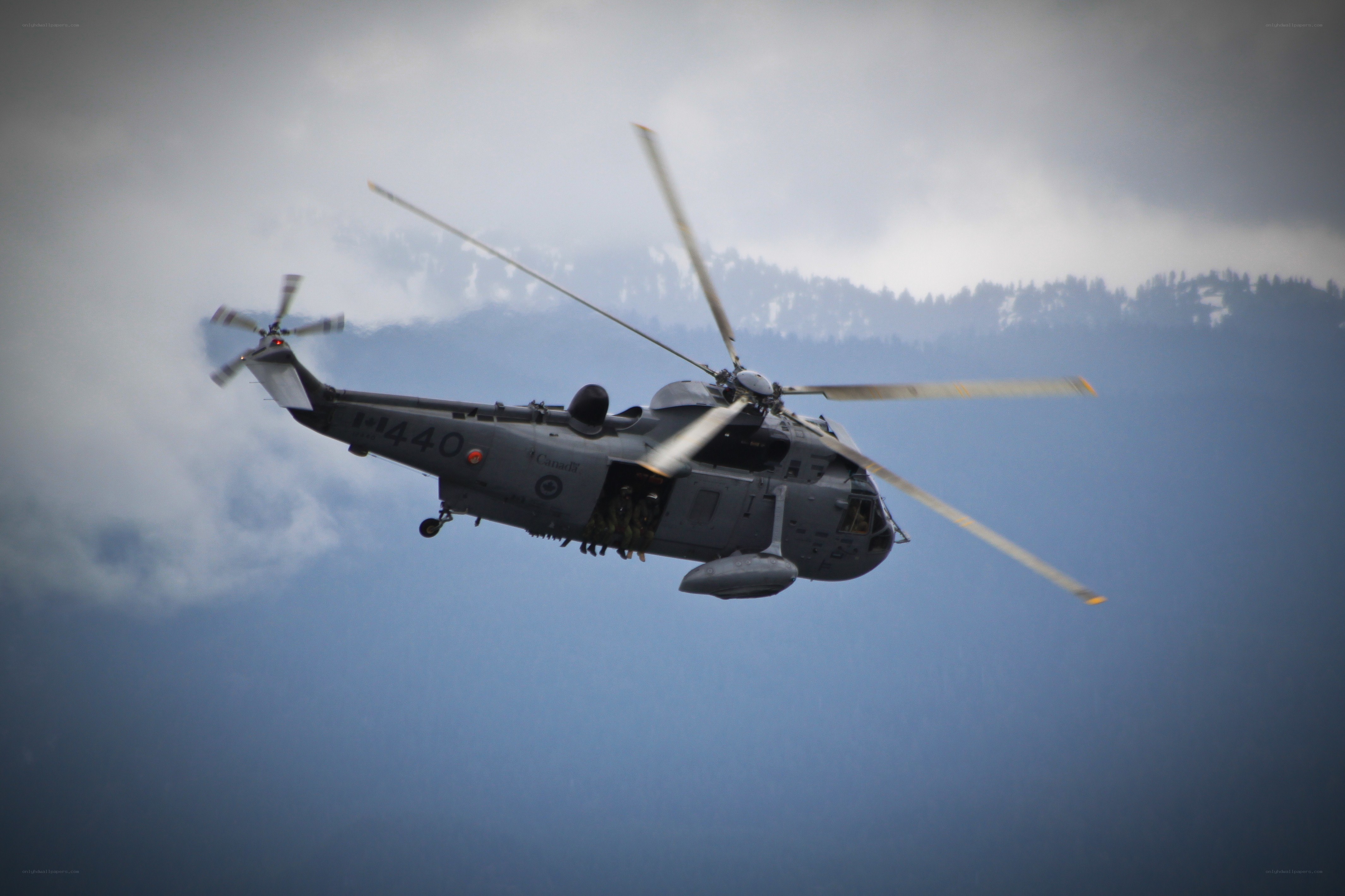 military helicopter in flight