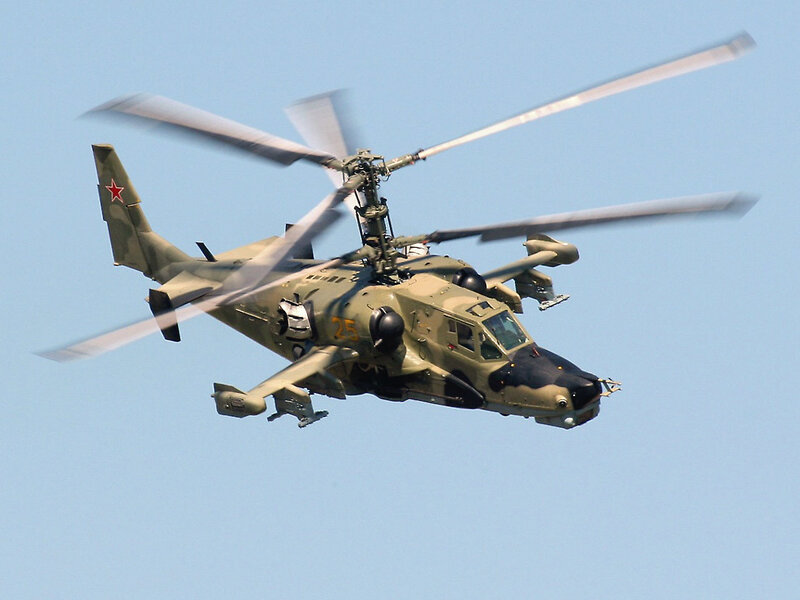 military helicopter in flight