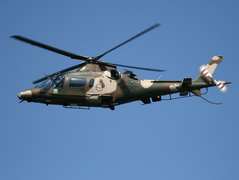 Military Helicopter in Flight — Blue, Clear, Afternoon, Photograph
