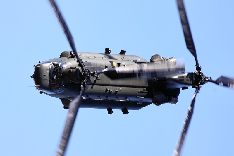 Military Helicopter in Flight — Blue, Dynamic, Afternoon, Photograph, Helicopter Blades