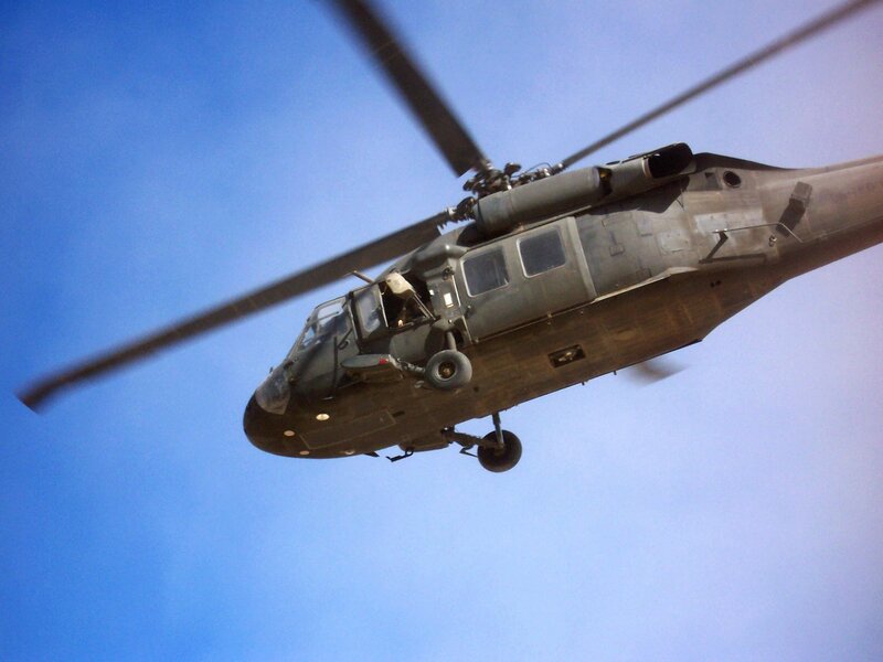 Military Helicopter in Flight — Blue, Dynamic, Afternoon
