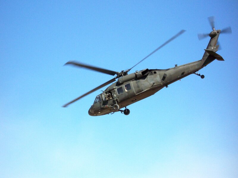 Military Helicopter in Flight — Blue