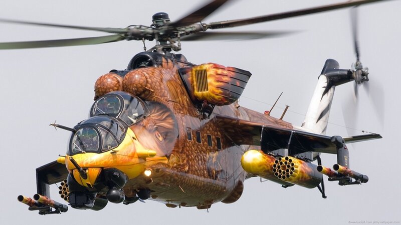 Military Helicopter in Flight — Brown, Dynamic, Photograph, Weapons