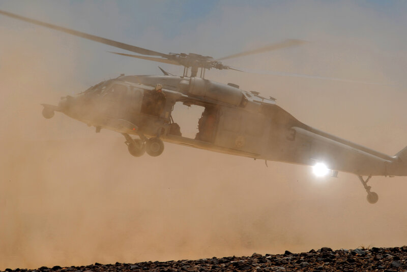Military Helicopter in Flight — Brown