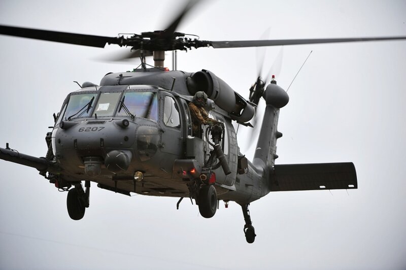 Military Helicopter in Flight — Gray, Dramatic, Photograph