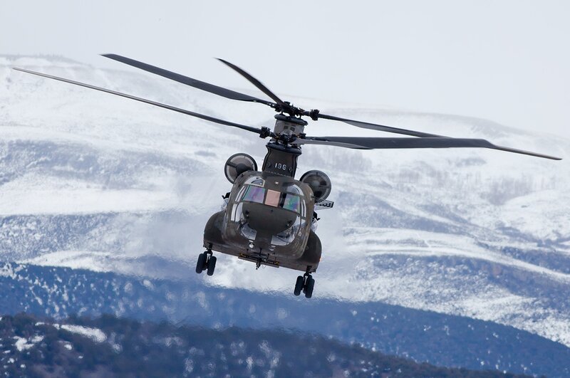 Military Helicopter in Flight — Gray, Dramatic, Winter