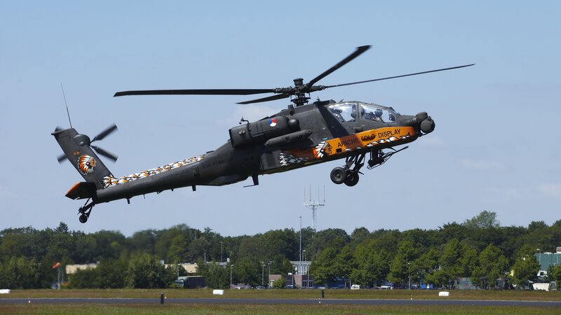 Military Helicopter in Flight — Gray, Dynamic, Afternoon, Photograph, Aircraft, Trees