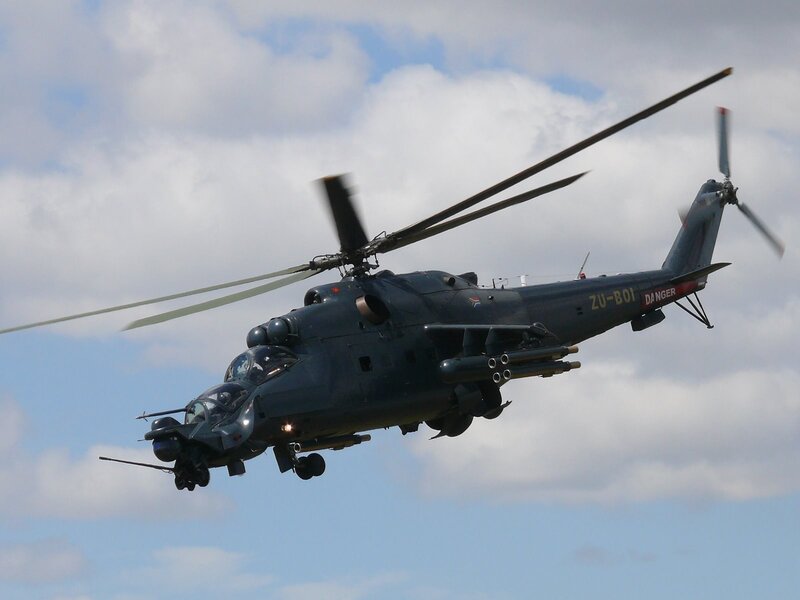 Military Helicopter in Flight — Gray, Dynamic, Afternoon, Photograph, Clouds