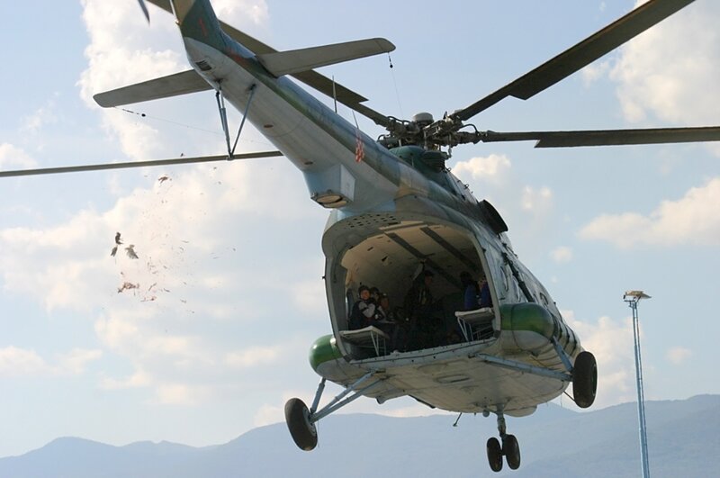 Military Helicopter in Flight — Green, Dramatic, Afternoon, Photograph, People
