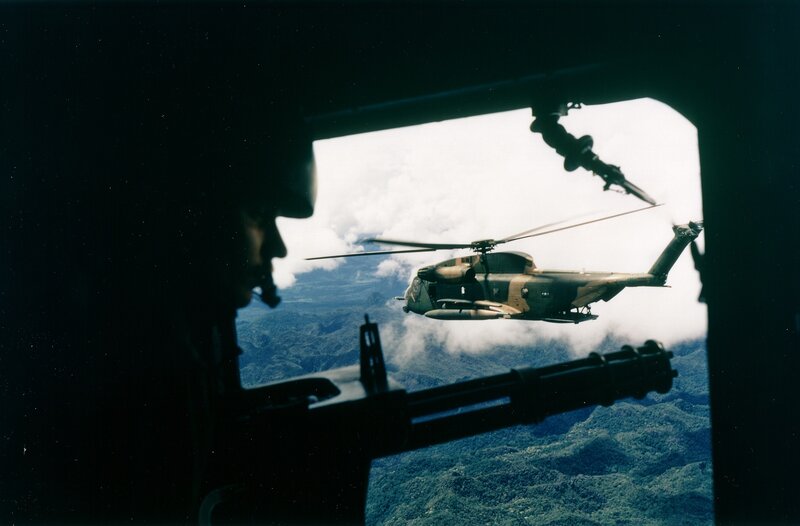 Military Helicopter in Flight — Green, Dramatic, Photograph, Soldier, Mountainous Terrain