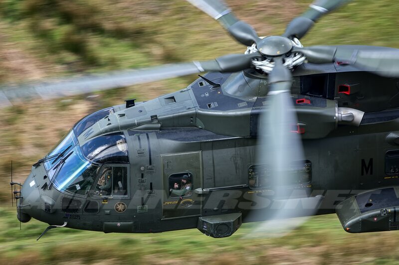 Military Helicopter in Flight — Green, Dynamic, Afternoon, Photograph, Pilot
