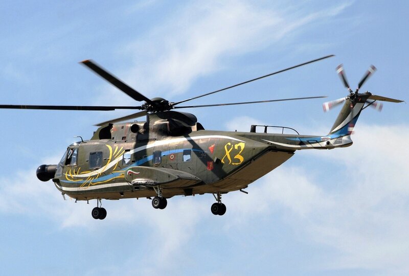 Military Helicopter in Flight — Green, Dynamic, Afternoon, Photograph, Rotors, Sky