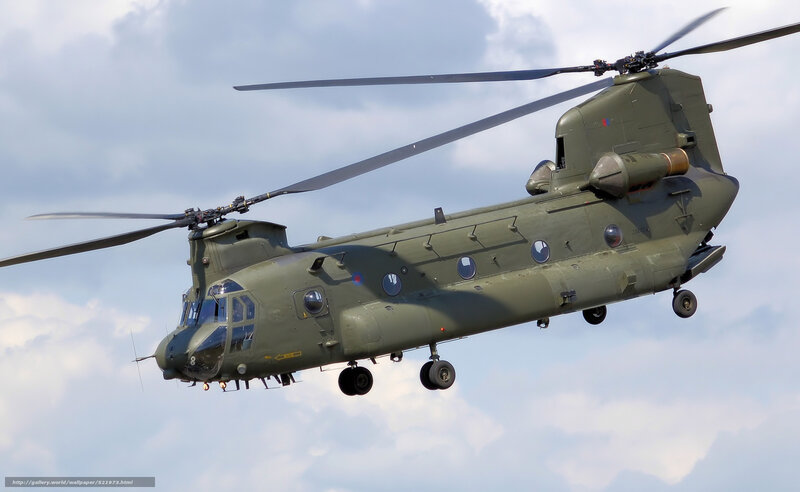Military Helicopter in Flight — Green, Dynamic, Afternoon, Photograph, Sky