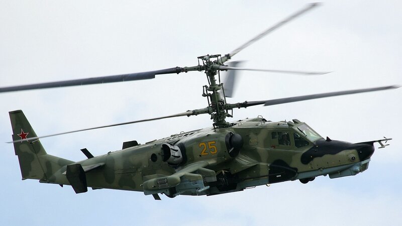 Military Helicopter in Flight — Green, Dynamic, Photograph, Rotor Blades, Camouflage Paint, Red Star