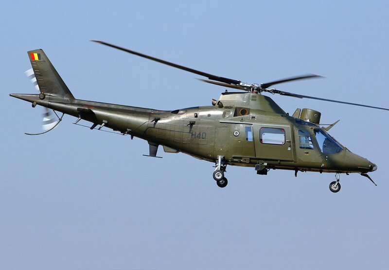 Military Helicopter in Flight — Green, Neutral, Afternoon, Photograph, Sky
