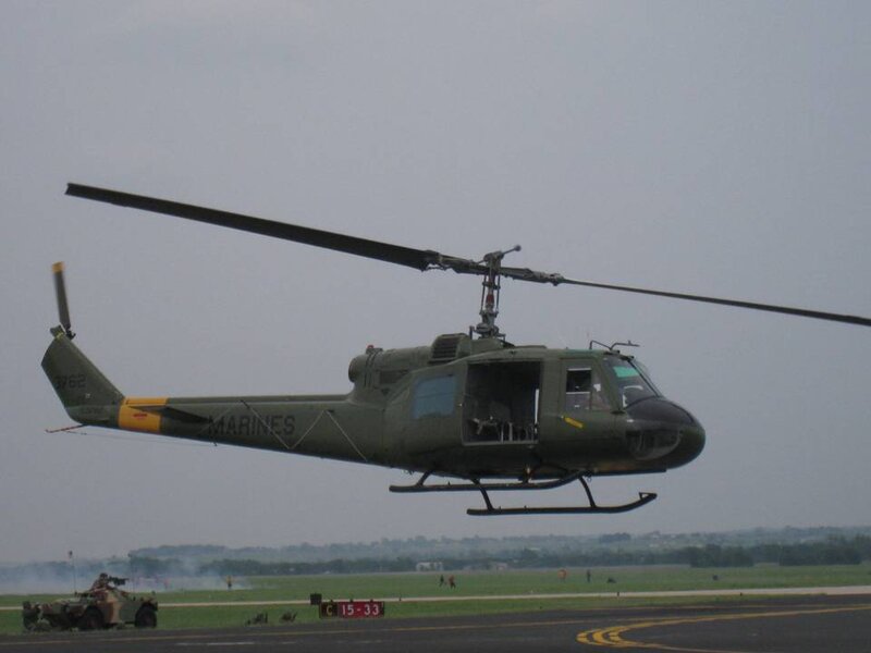 Military Helicopter in Flight — Green, Neutral, Afternoon