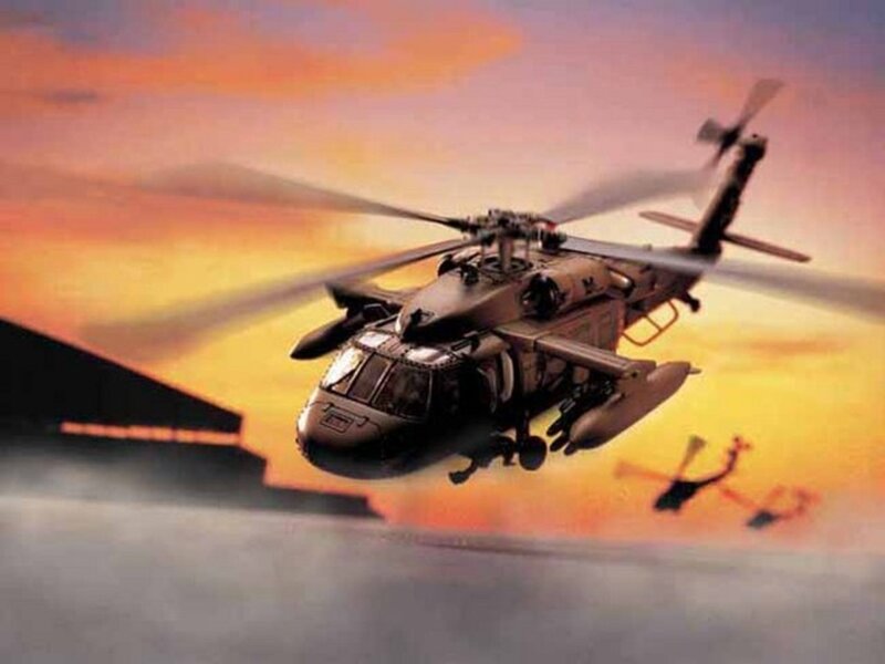 Military Helicopter in Flight — Orange