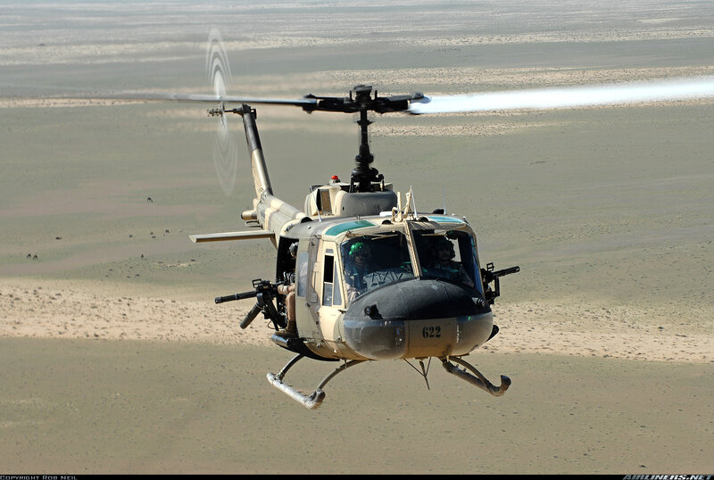 Military Helicopter in Flight — Tan