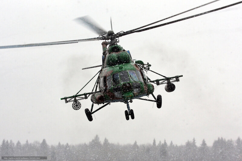Military helicopter in snowstorm