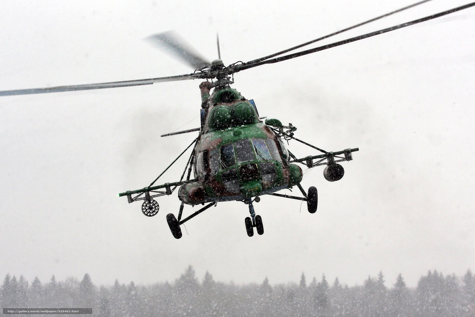 Military helicopter in snowstorm
