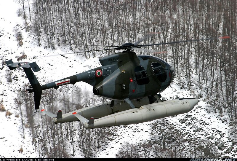 Military helicopter in snowy forest