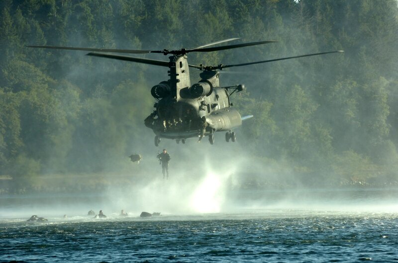 Military helicopter landing on water
