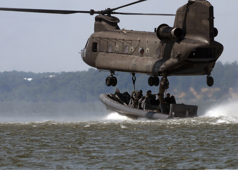 Military Helicopter Lifting Boat