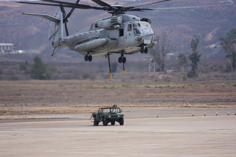 Military helicopter lifting vehicle