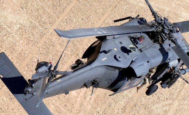 Military helicopter on desert ground