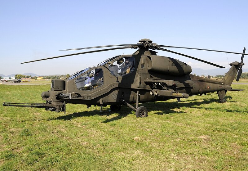 Military helicopter on grass field