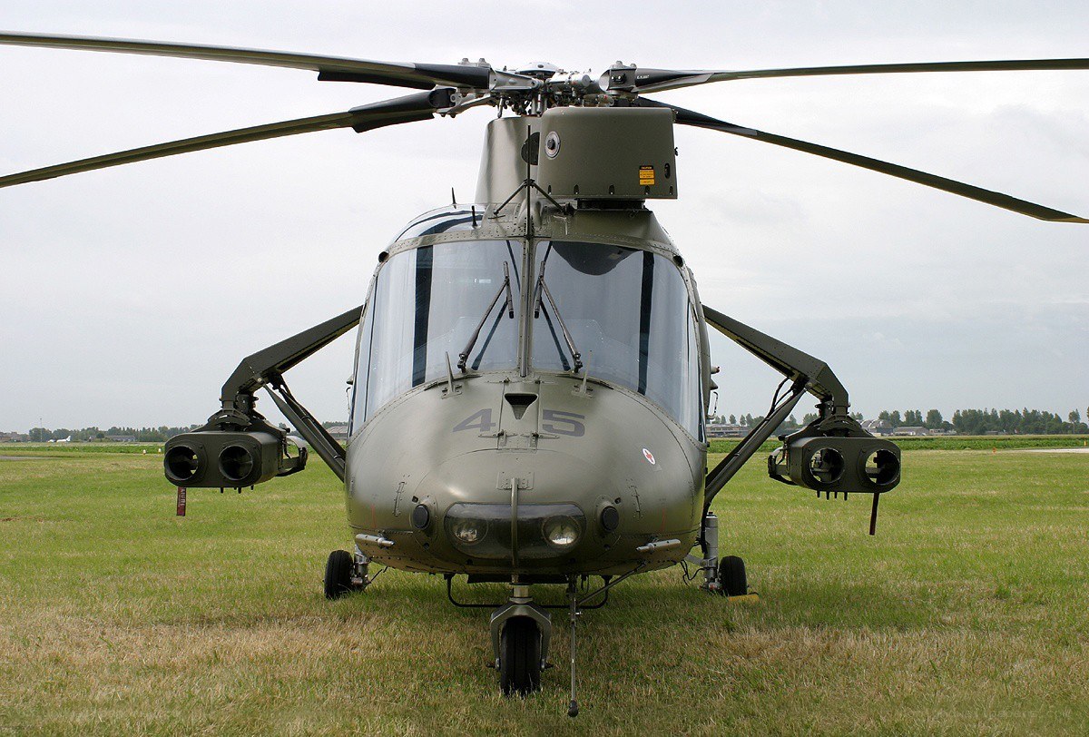military helicopter on grass field