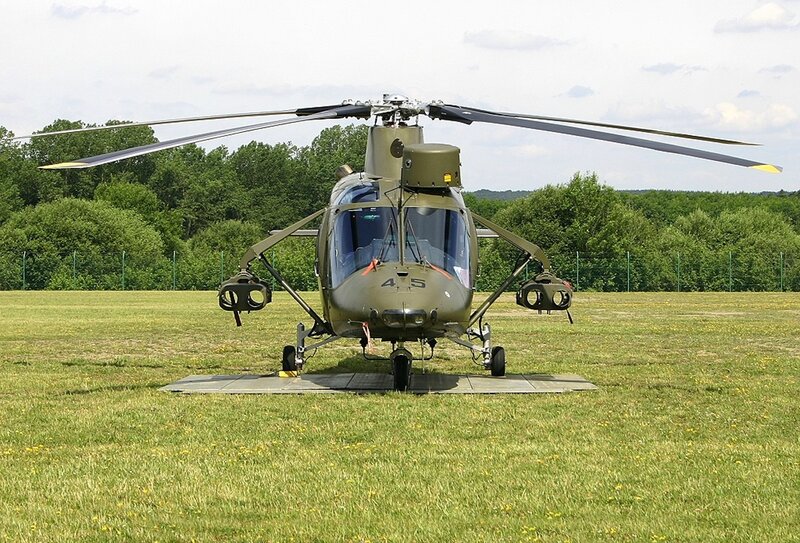 Military helicopter on grass field