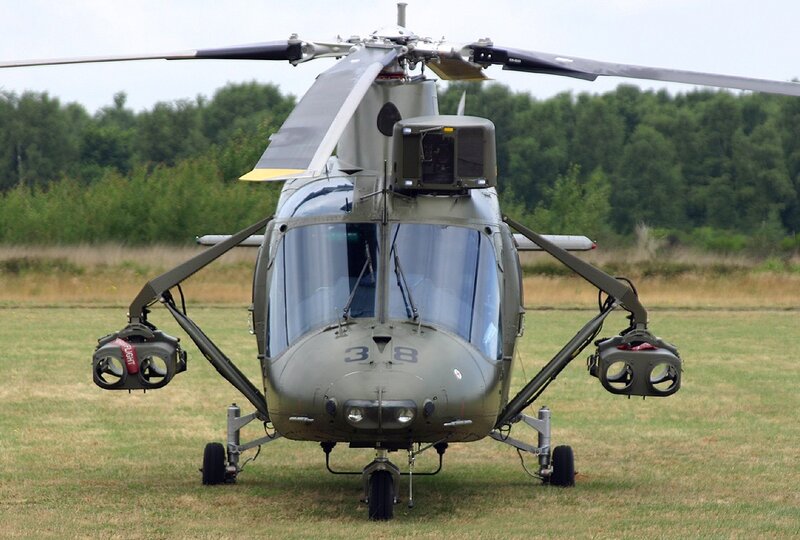 Military helicopter on grass field