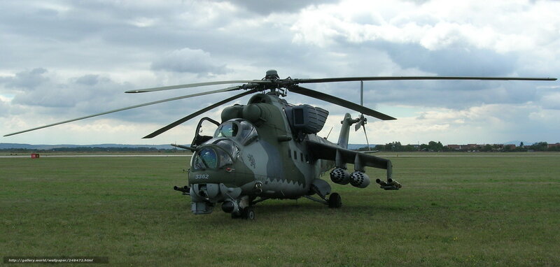 Military helicopter on grass field