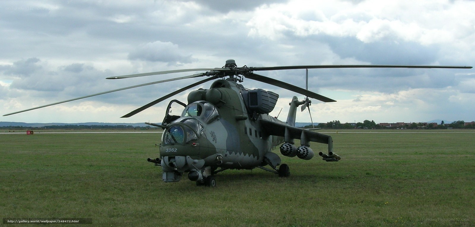 Military helicopter on grass field