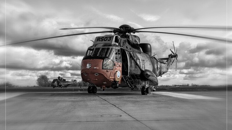 Military Helicopter on Tarmac — Black, Dramatic
