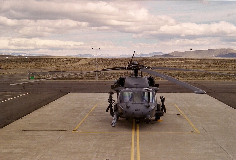 Military Helicopter on Tarmac — Gray, Dramatic