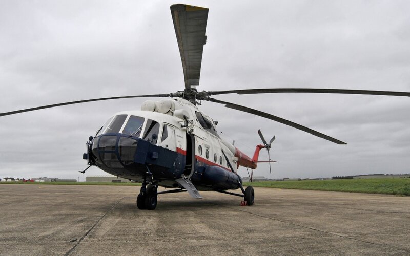 Military Helicopter on Tarmac — Gray, Overcast, Photograph
