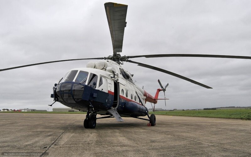 Military Helicopter on Tarmac — Gray, Overcast