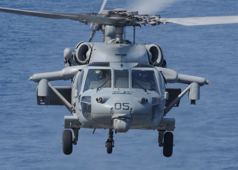 Military helicopter over ocean