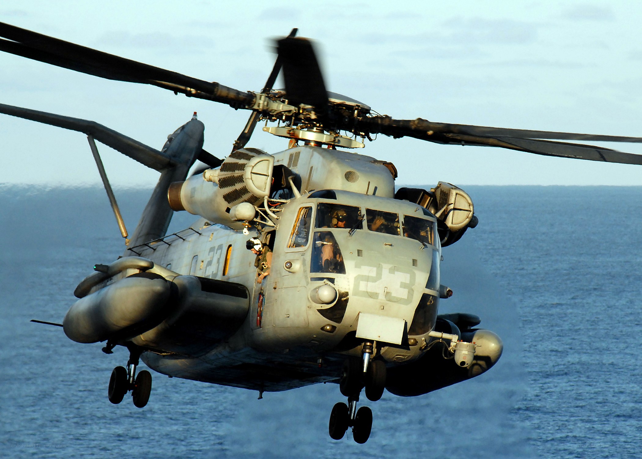 Military helicopter over ocean