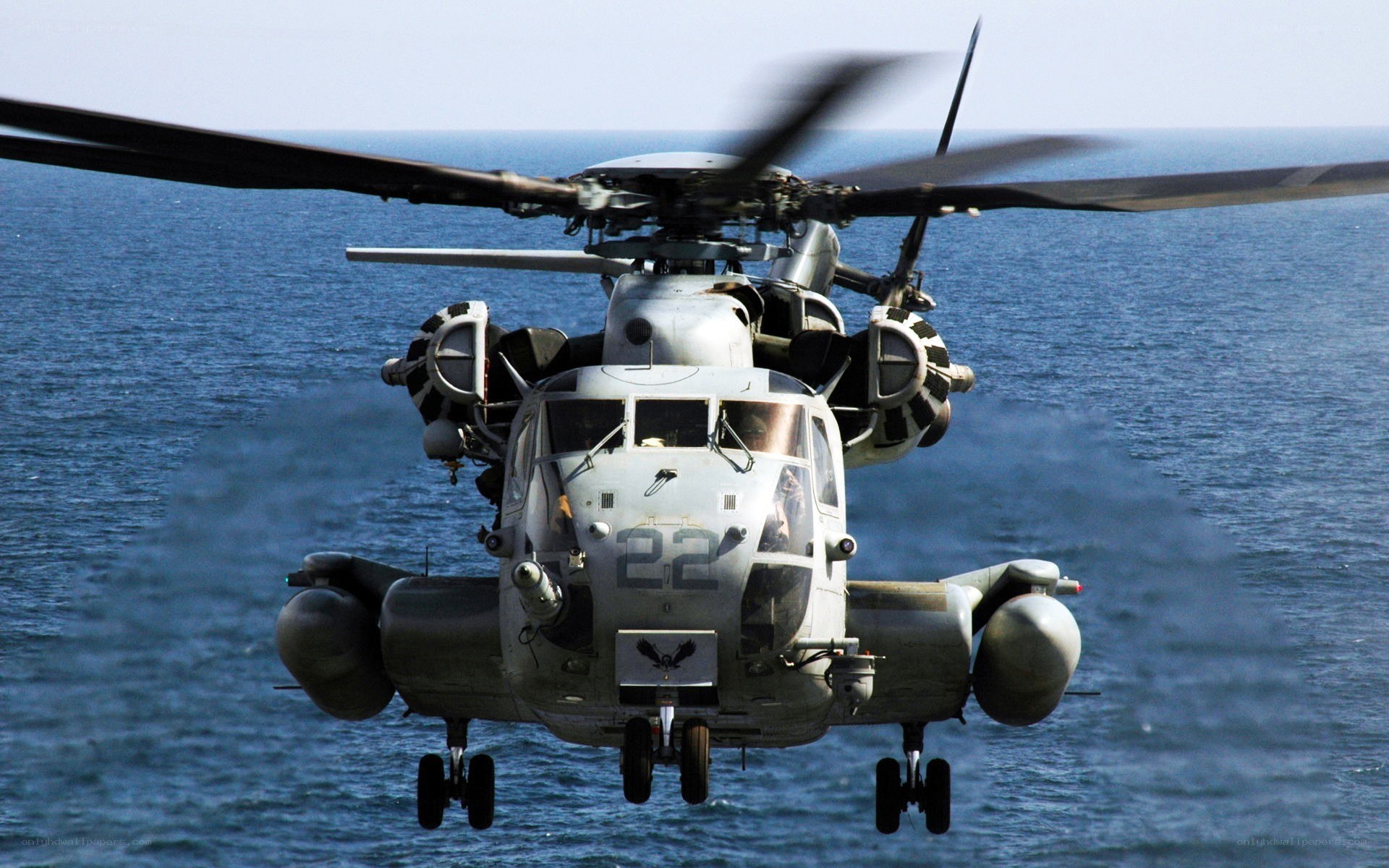Military helicopter over ocean