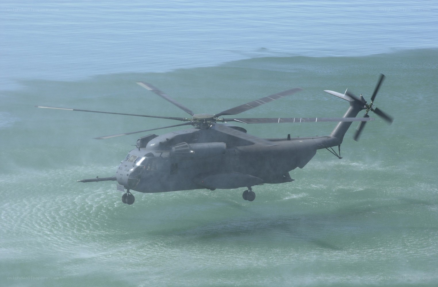 Military helicopter over ocean