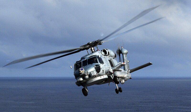 Military helicopter over ocean