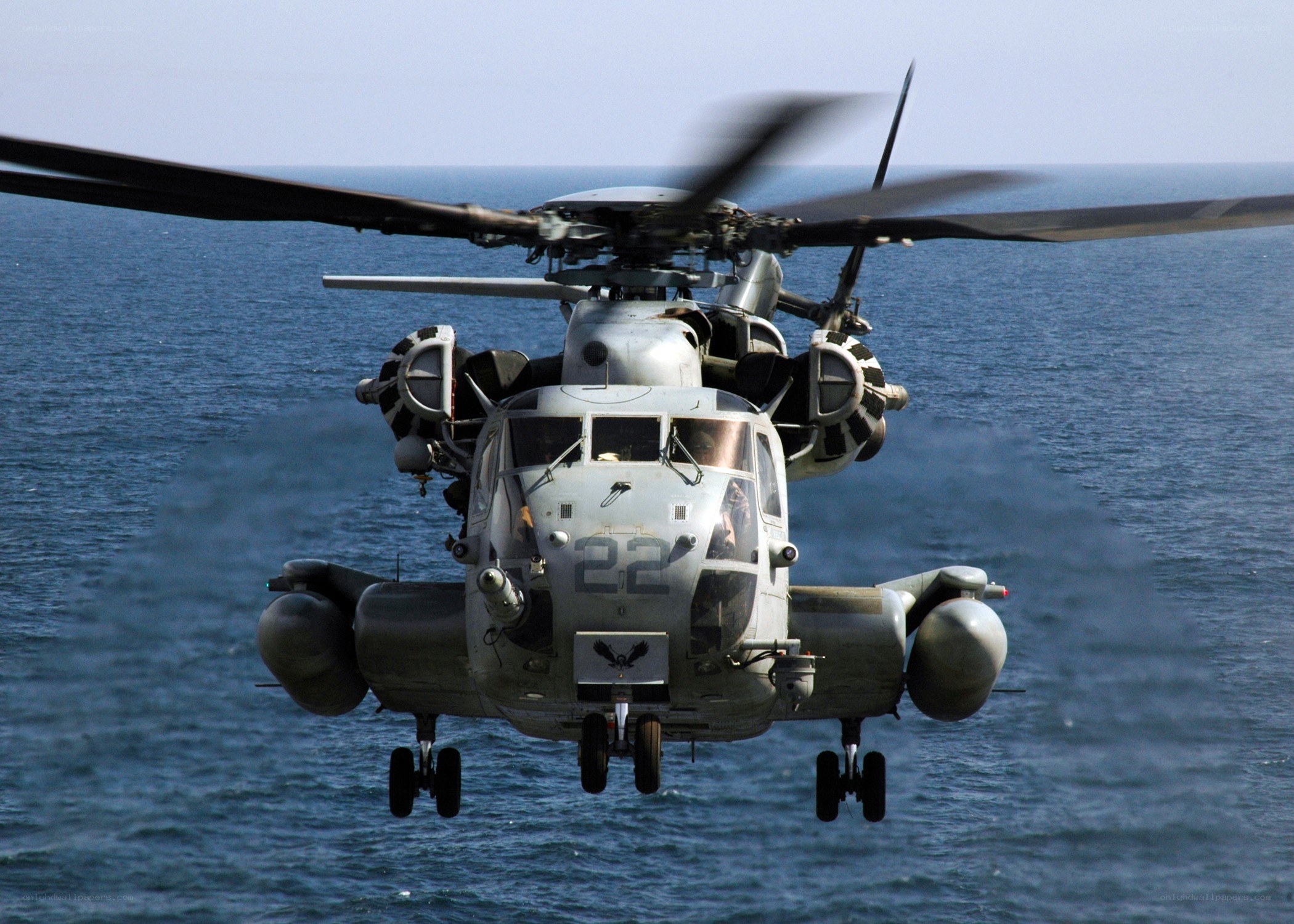 Military helicopter over ocean