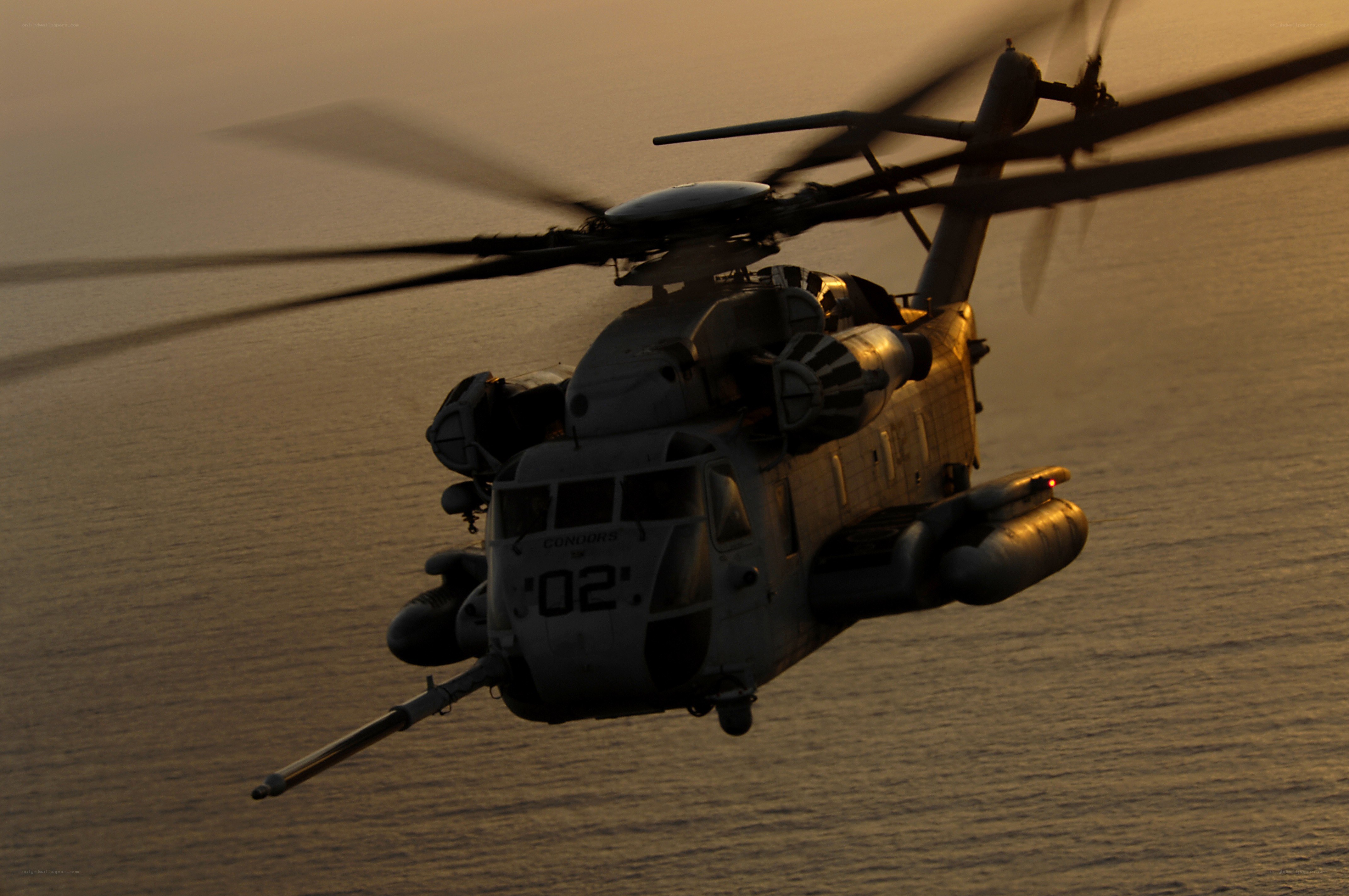 Military helicopter over ocean