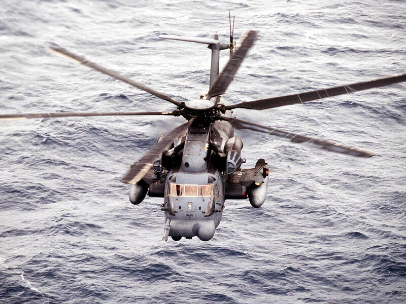 Military Helicopter over Ocean — Gray, Dramatic, Photograph, Rotor Blades