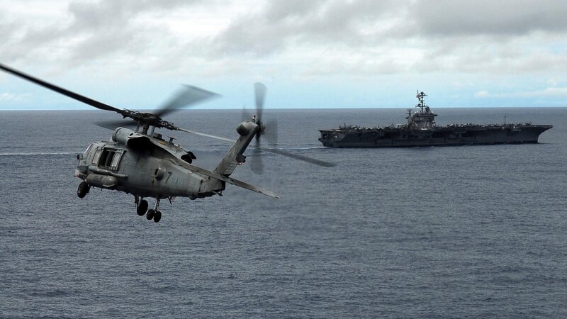 Military Helicopter over Ocean — Gray, Dramatic