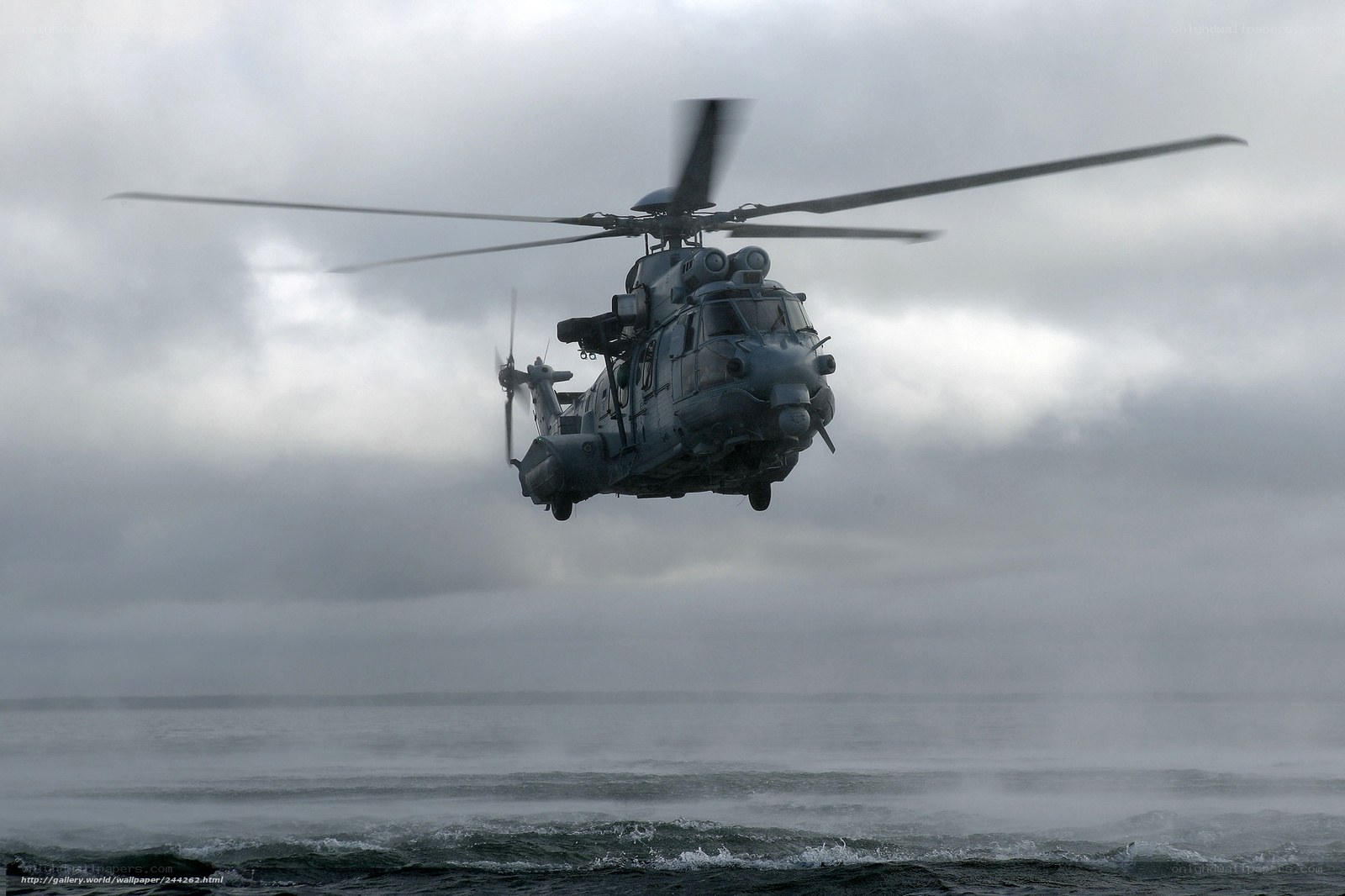 Military helicopter over ocean