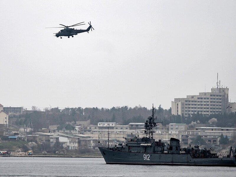 Military Helicopter over Ship